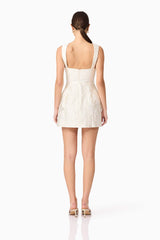 Brunette model wearing Galadirel Mini Dress in White back shot