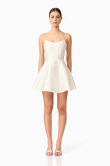 Brunette model wearing Galadirel Strapless Mini Dress in White front shot