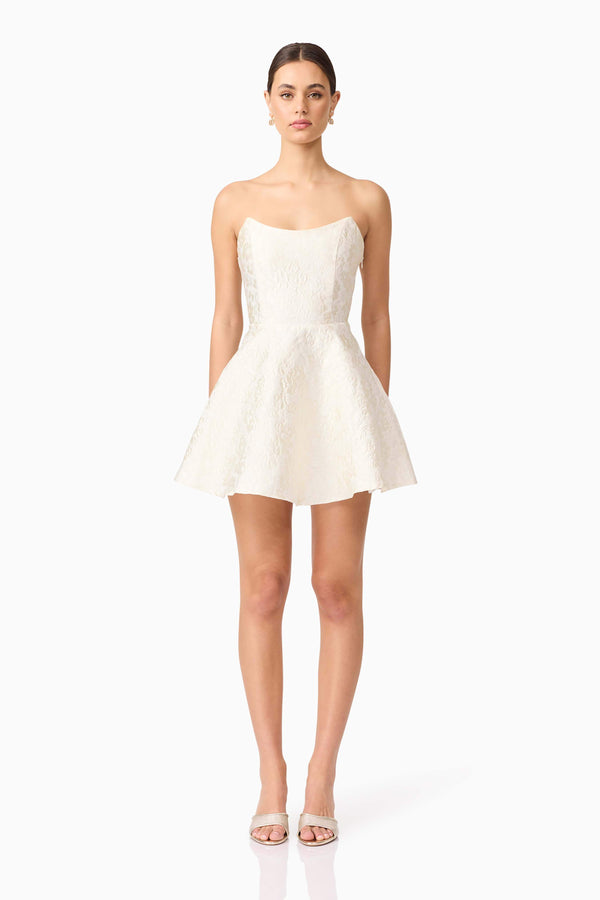 Brunette model wearing Galadirel Strapless Mini Dress in White front shot