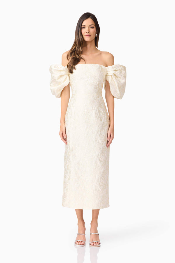 Brunette model wearing Galadirel Puff Sleeve Midi Dress in White front shot
