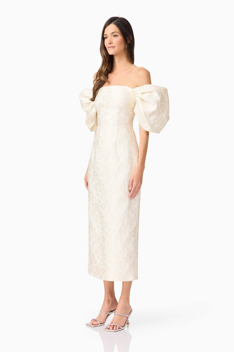 Brunette model wearing Galadirel Puff Sleeve Midi Dress in White side shot