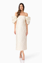 Brunette model wearing Galadirel Puff Sleeve Midi Dress in White posed shot