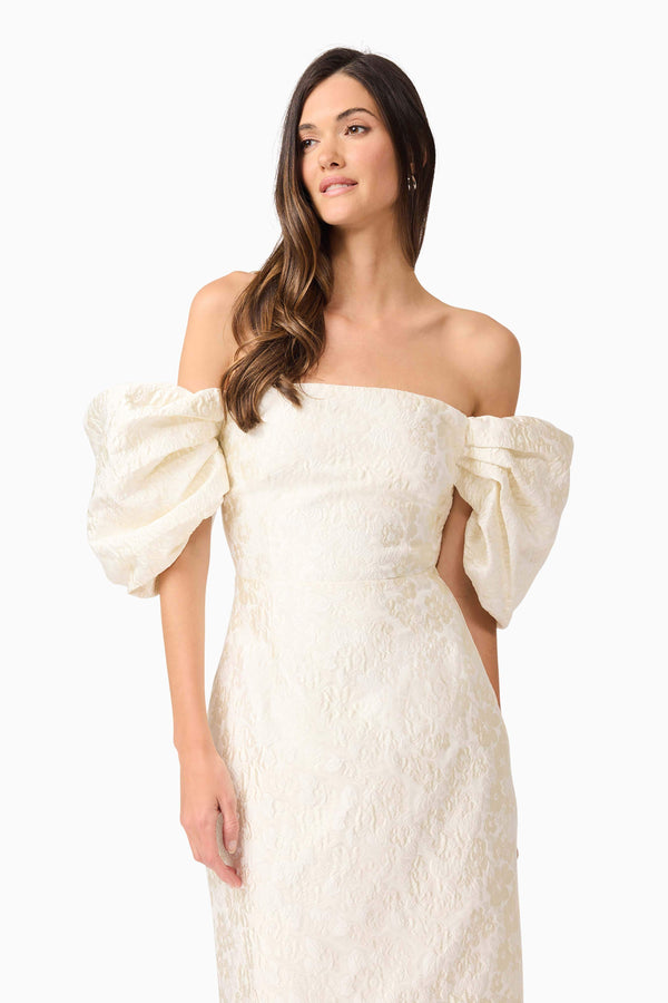 Brunette model wearing Galadirel Puff Sleeve Midi Dress in White close up shot