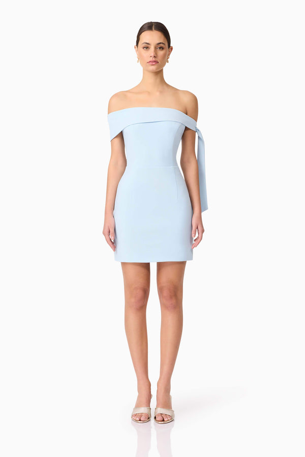 Brunette model wearing Ami Off The Shoulder Mini Dress in Blue front shot