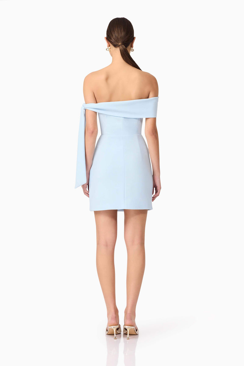 Brunette model wearing Ami Off The Shoulder Mini Dress in Blue back shot