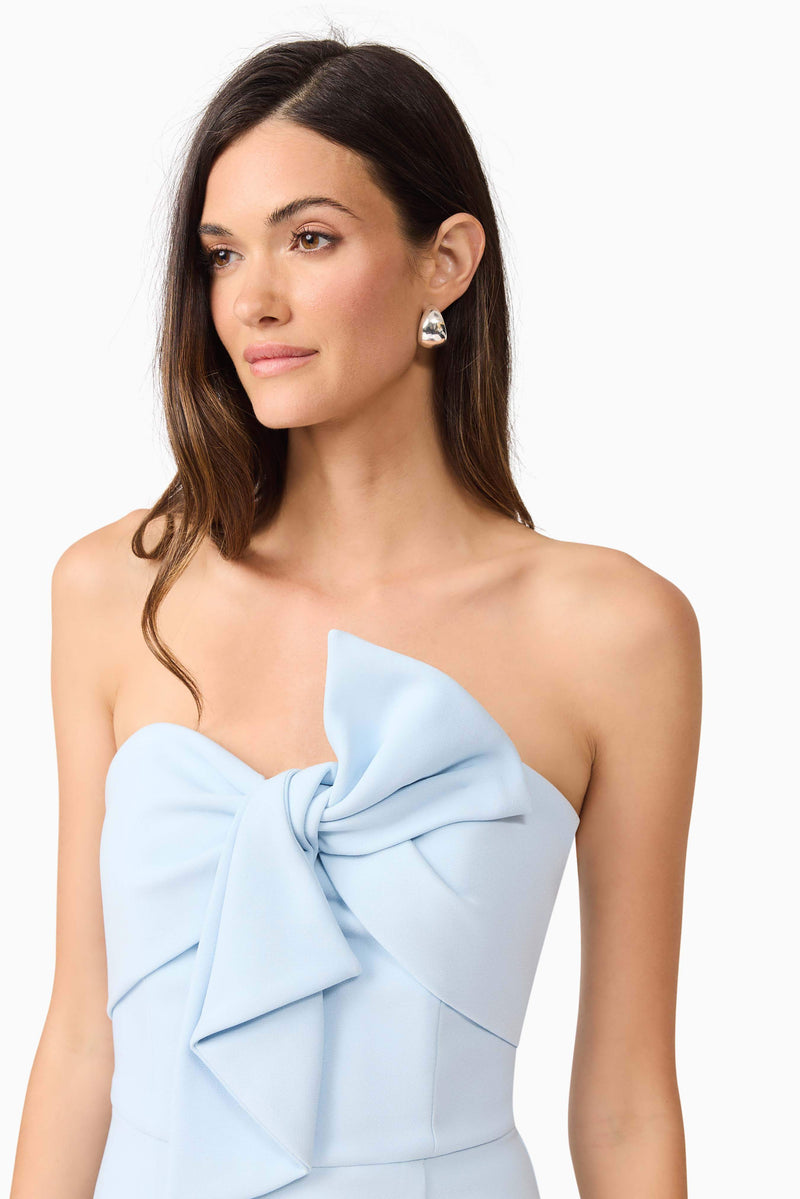 Brunette model wearing Ami Strapless Midi Dress in Blue close up shot
