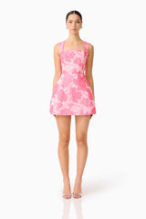 Brunette model wearing the Dionne Tulip Mini Dress in Pink Floral front shot