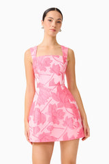 Brunette model wearing the Dionne Tulip Mini Dress in Pink Floral close up shot