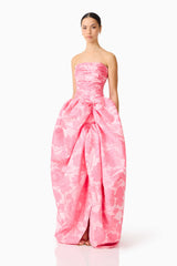 Brunette model wearing the Dionne Strapless Gown in Pink Floral side
 shot