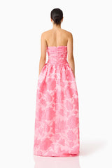 Brunette model wearing the Dionne Strapless Gown in Pink Floral back
 shot