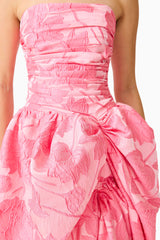 Brunette model wearing the Dionne Strapless Gown in Pink Floral close up
 shot