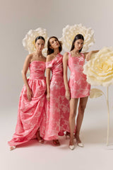 Brunette model wearing the Dionne Tulip Mini Dress in Pink Floral campaign shot