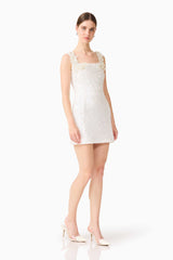 Brunette model wearing the Alessia Embellished Mini Dress in White posed shot