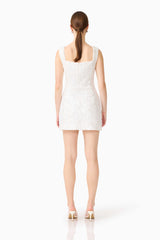 Brunette model wearing the Alessia Embellished Mini Dress in White back shot