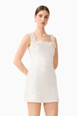 Brunette model wearing the Alessia Embellished Mini Dress in White close up shot