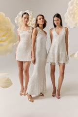 Brunette model wearing Alessia Embellished Shift Mini Dress in White campaign shot 