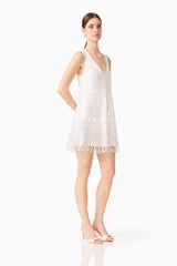 Brunette model wearing Alessia Embellished Shift Mini Dress in White posed shot 