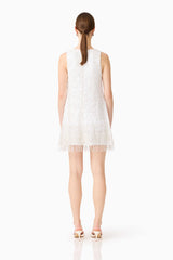 Brunette model wearing Alessia Embellished Shift Mini Dress in White back shot 