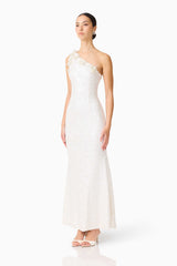 Brunette model wearing the Alessia Embellished One Shoulder Gown in White side shot 