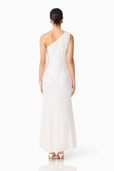 Brunette model wearing the Alessia Embellished One Shoulder Gown in White back shot 