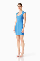 Brunette model wearing theElena V-Neck Mini Dress in Dress in Blue side shot