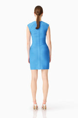 Brunette model wearing theElena V-Neck Mini Dress in Dress in Blue back shot