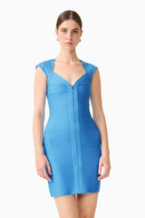 Brunette model wearing theElena V-Neck Mini Dress in Dress in Blue close up shot