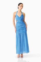 Brunette model wearing the Elena Halter Gown in Blue posed shot