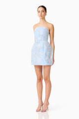 Brunette model wearing the Annabelle Embellished Strapless Mini Dress in Blue side shot 