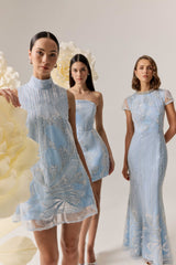 Brunette model wearing the Annabelle Embellished Shift Mini Dress in Blue campaign shot