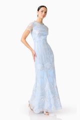 Brunette model wearing the Annabelle Embellished Gown in Blue posed shot 