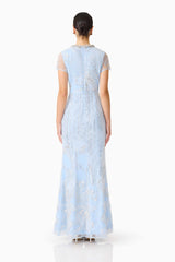 Brunette model wearing the Annabelle Embellished Gown in Blue back shot 