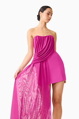 Brunette model wearing the Chantal Asymmetrical Mini Dress in Pink close up shot 