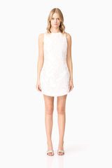 Blonde model wearing Elara Shift Dress in White front shot