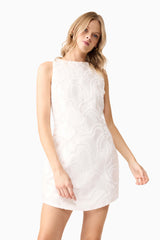 Blonde model wearing Elara Shift Dress in White close up posed shot 