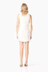 Blonde model wearing Elara Shift Dress in White back shot 