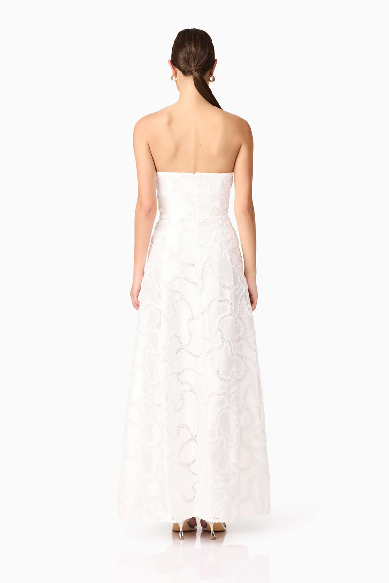Brunette model wearing Elara Beaded Gown in White back shot 