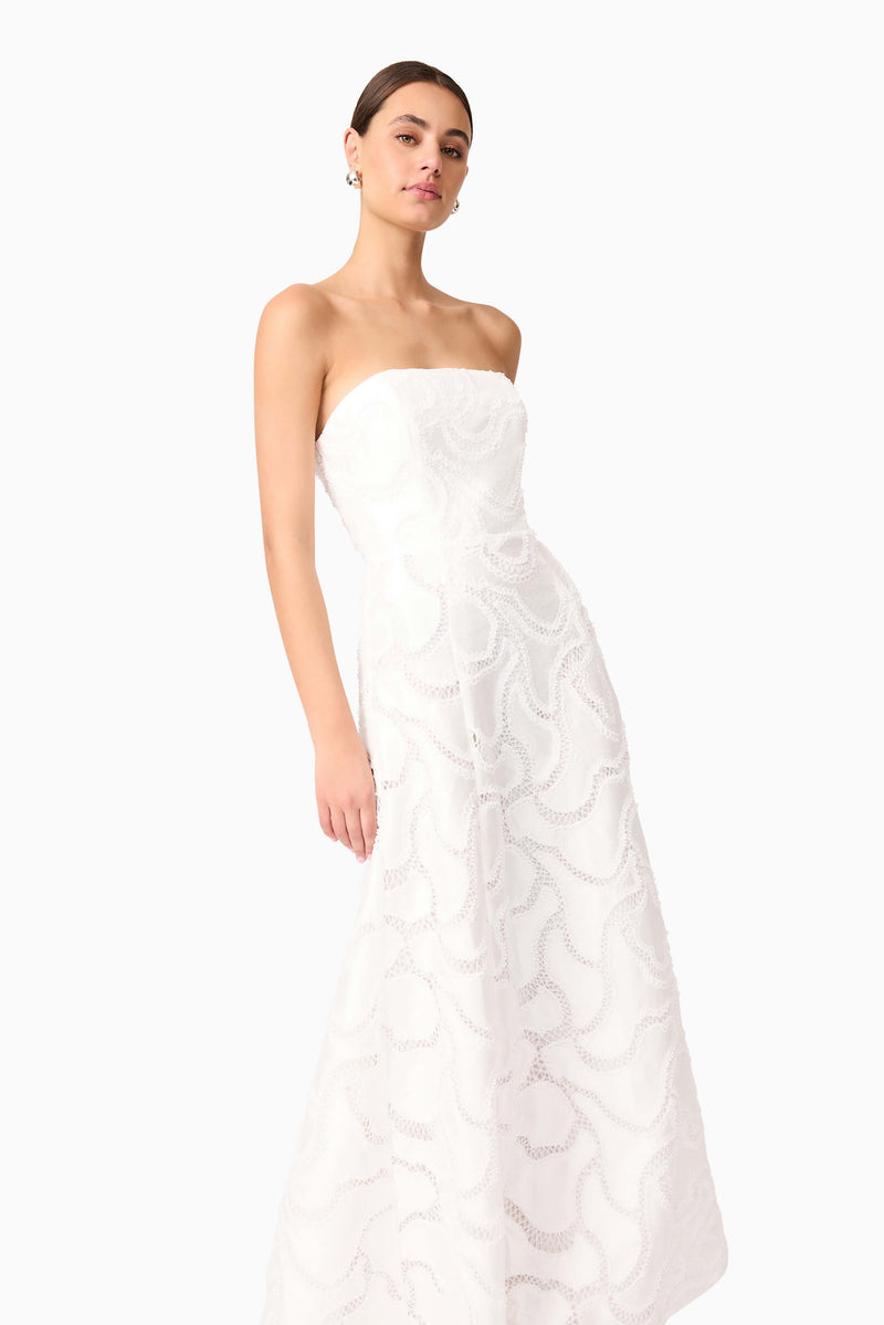 Brunette model wearing Elara Beaded Gown in White close up shot 