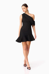 Brunette model wearing Ava Asymmetrical Mini Dress in Black posed shot