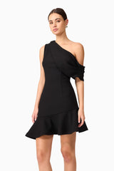 Brunette model wearing Ava Asymmetrical Mini Dress in Black close up posed shot