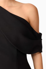 Brunette model wearing Ava Asymmetrical Mini Dress in Black detail shot