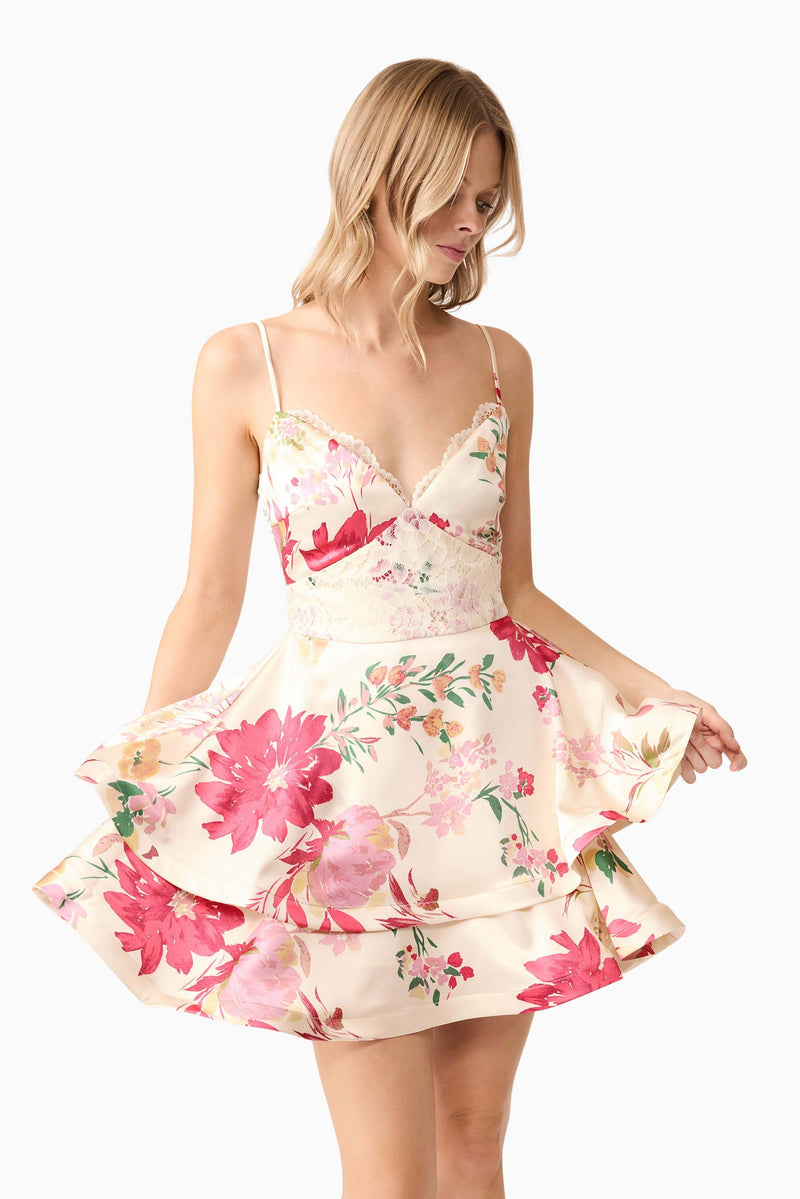 Blonde model wearing Rosalina Tiered Mini Dress in Floral close up shot