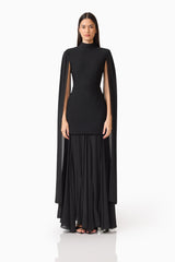 Brunette model wearing the Odelia Cape Sleeve Gown in Black front shot