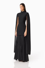 Brunette model wearing the Odelia Cape Sleeve Gown in Black side shot