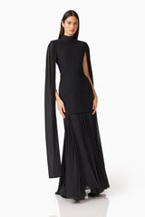 Brunette model wearing the Odelia Cape Sleeve Gown in Black posed shot