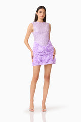 Brunette model wearing the Cerise Embellished Mini Dress in Purple posed with her hands on her hips