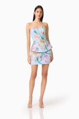 Brunette model wearing the Priselle Peplum Top & Mini Skirt Set in Blue Floral posed shot