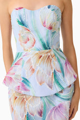 Brunette model wearing the Priselle Peplum Top & Mini Skirt Set in Blue Floral close up shot