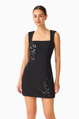 Brunette model wears the Odelia Beaded Mini Dress in Black close up shot