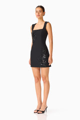 Brunette model wears the Odelia Beaded Mini Dress in Black side shot